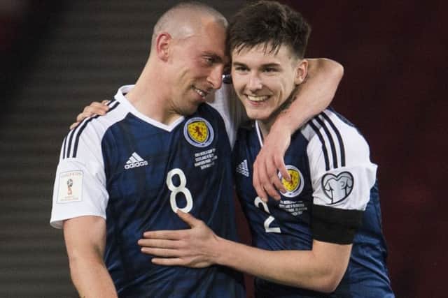 Kieran Tierney, right, with his Celtic team-mate Scott Brown after Scotland's 2017 win over Slovenia. Picture: SNS