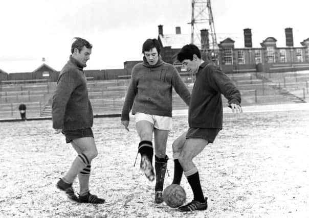 Jim Townsend, Alex McDonald and Donald Ford take part in a snowy training session at Tynecastle in February 1969. Picture: TSPL