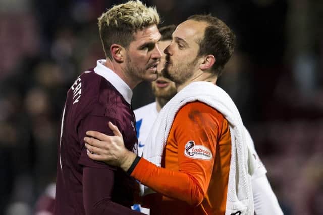 Hearts' Kyle Lafferty with Jamie MacDonald at full time. The  Kilmarnock goalkeeper saved his penalty. Picture: Craig Foy/SNS