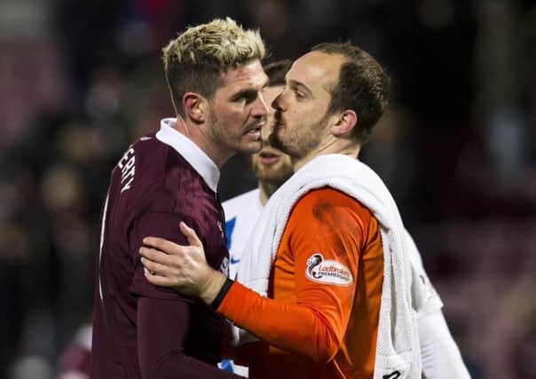 Hearts' Kyle Lafferty with Jamie MacDonald at full time. The  Kilmarnock goalkeeper saved his penalty. Picture: Craig Foy/SNS