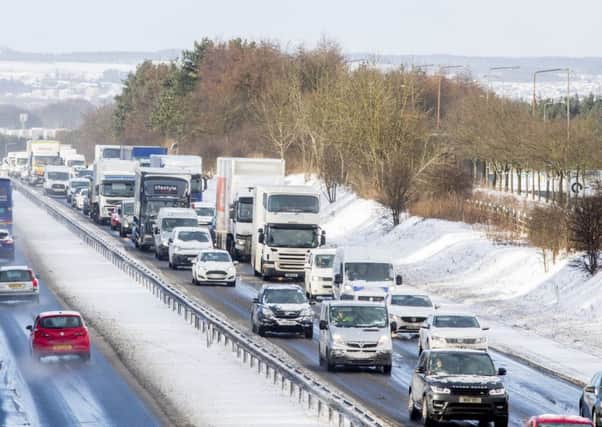 There have been a number of delays on the M8 this morning after heavy snow fall. Picture; SWNS
