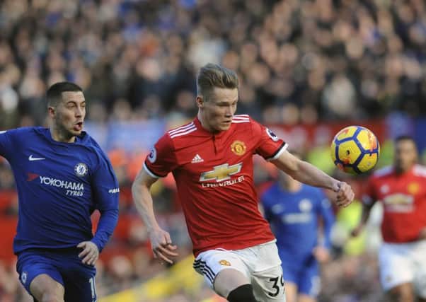 Manchester United's Scott McTominay competes with Chelsea's Eden Hazard. Picture: Rui Vieira/AP