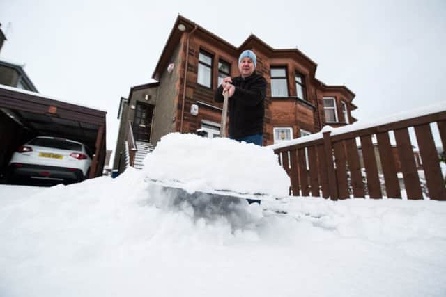 People across Scotland faced having to dig out of their driveways. Picture: John Devlin