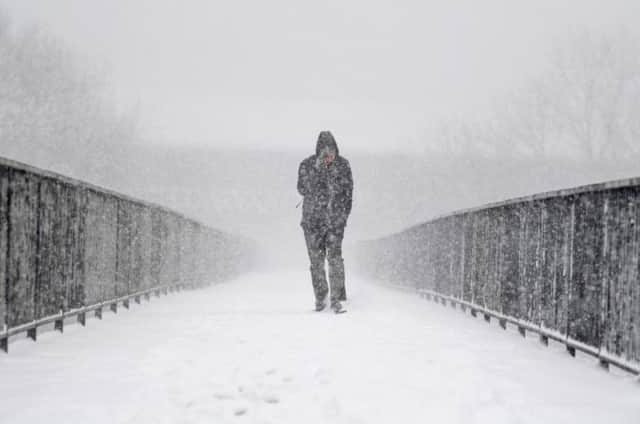 A care worker has died travelling in the snow in Glasgow