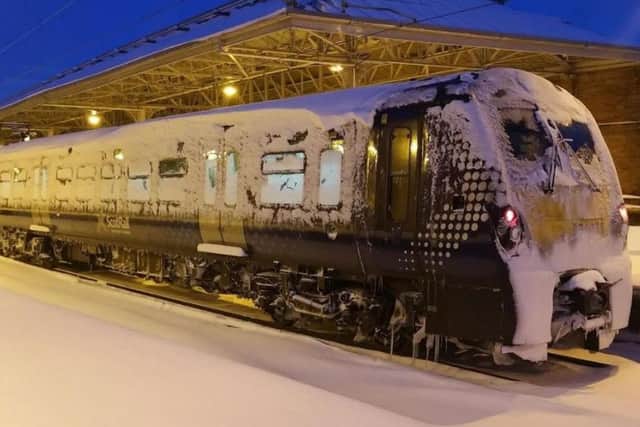 A Scotrail train covered in snow. Picture; Darrel Hendrie