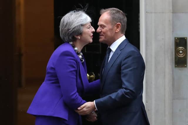 Britain's Prime Minister Theresa May (L) greets European Council President Donald Tusk at 10 Downing Street. Picture: Daniel Leal