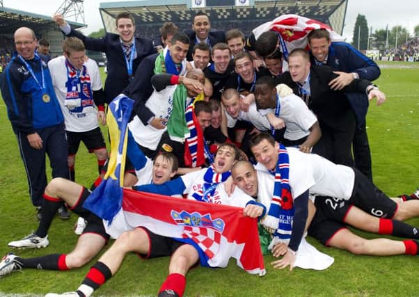 Rangers players celebrate clinching the title by defeating Kilmarnock 5-1 at Rugby Park on the final day of the 2010-11 season. Picture: SNS