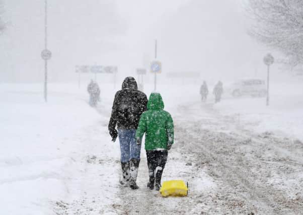 Scots make their way through the snowy weather on March 1. Picture: Jeff J Mitchell/Getty Images