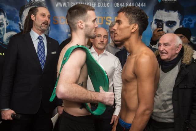 WBC Silver belt champion Josh Taylor, left, and Nicaragua's Winston Campos at the weigh-in in Glasgow. Picture: John Devlin