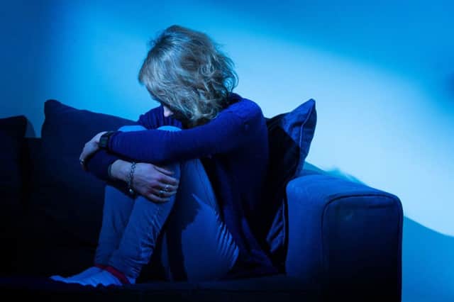 A woman showing signs of depression. Picture: Dominic Lipinski/PA Wire