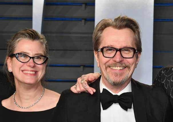 Gary Oldman with wife Gisele Schmidt after recieving his Oscar. Picture: Getty