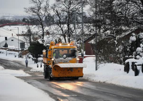 A snowplough clears the road. Picture: Jeff J Mitchell/Getty Images