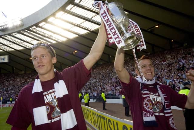 Christophe Berra celebrates the 2006 cup triumph with Hearts team-mate Roman Bednar. Picture: SNS.