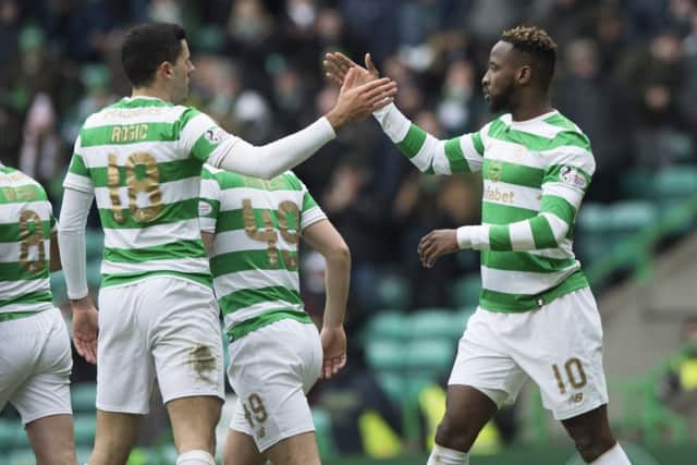 Celtic's Moussa Dembele celebrates his first goal with his teammates. Picture: SNS/Alan Harvey