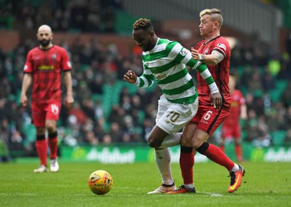 Celtic's Moussa Dembele challenge for the ball with Morton's Michael Doyle. Picture: SNS/Craig Foy