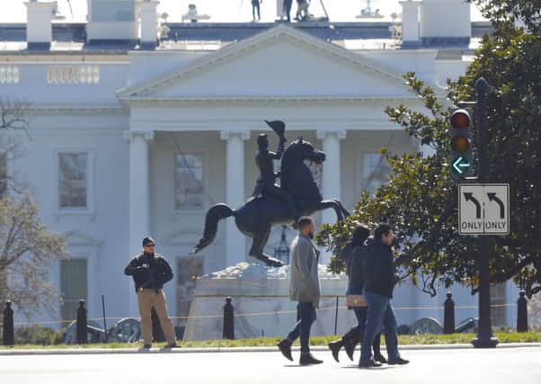 Law enforcement officer stands at the entrance to Lafayette Park across from the White House. Picture: AP Photo/Pablo Martinez Monsivais