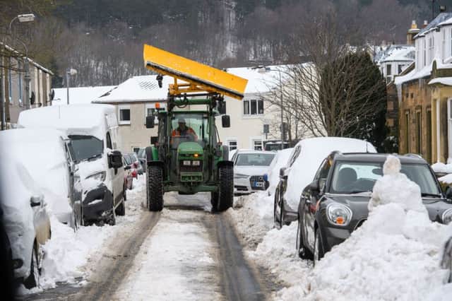 A tractor clears snow in Peebles. Picture: Ian Georgeson
