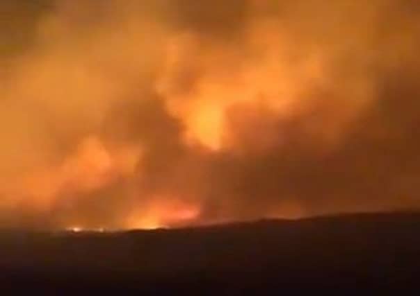 One of the fires on Barra lighting up the night sky. Picture: Angus B MacNeil/Twitter