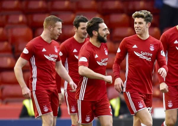 Ryan Christie, right, celebrates with goalscorer Graeme Shinnie after Aberdeen took an early lead against Kilmarnock. Picture: SNS