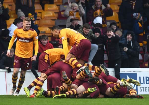 Motherwell players celebrate Carl McHugh's goal to make it 2-1. Picture: SNS