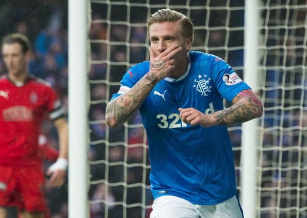 Jason Cummings celebrates after scoring the first of his three goals. Picture: SNS