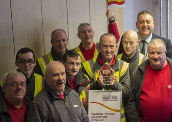 Glasgow Housing Association's North East teams get their hands on the EFQM trophy