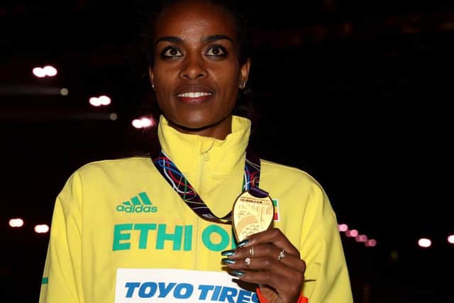 Ethiopia's gold medal winner Genzebe Dibaba after the 1500m final during day three of the World Indoor Championship sin  Birmingham.
