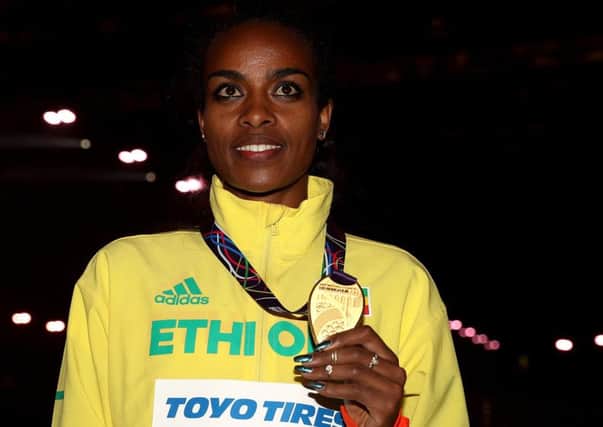 Ethiopia's gold medal winner Genzebe Dibaba after the 1500m final during day three of the World Indoor Championship sin  Birmingham.