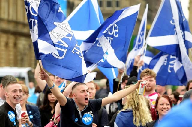 Yes supporters gather in George Square, just a few hours before polling stations closed in the Scottish independence referendum in 2014. Scots are unlikely to be given the option of voting online given concerns over technology. Picture: Jeff J Mitchell/Getty Images