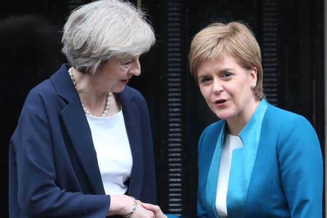 Nicola Sturgeon claims Theresa May's Government is attempt a 'power grab' of areas currently controlled by Brussels