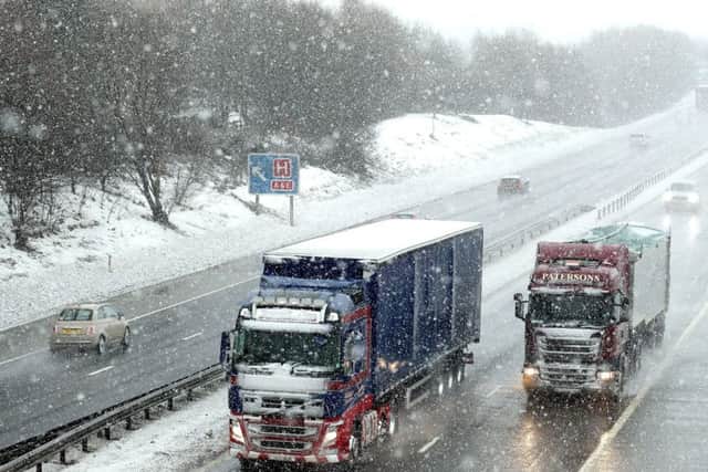 Traffic on the M876 near Larbert in Scotland as snow falls. Picture; PA