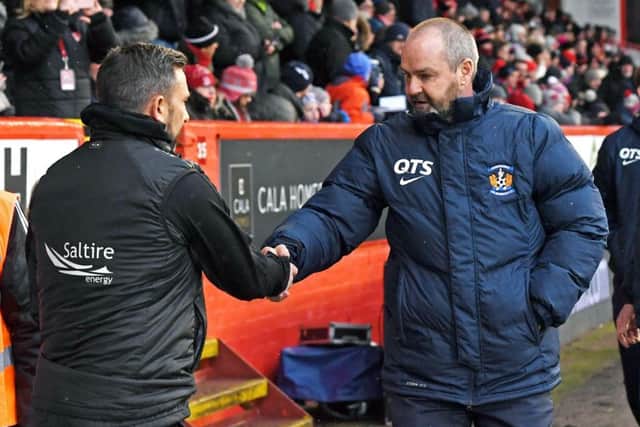 A handshake at Pittodrie on Saturday, but Steve Clarke, right, is unhappy about Derek McInnes' comments. Picture: SNS.