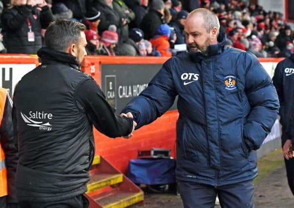 A handshake at Pittodrie on Saturday, but Steve Clarke, right, is unhappy about Derek McInnes' comments. Picture: SNS.