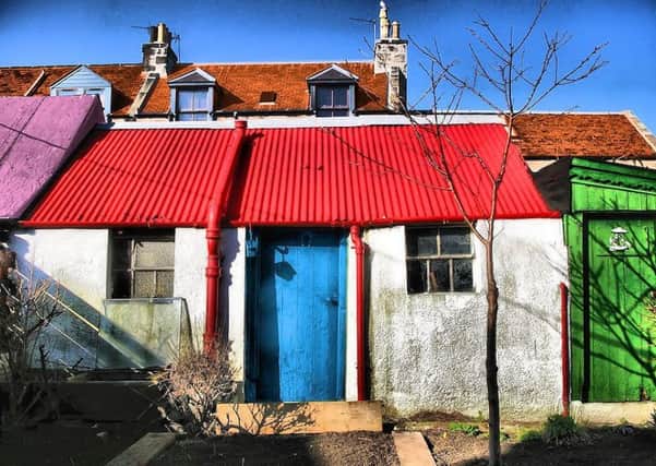 The old sheds and washouses of Footdee have been done up in mish mash of colours and cheery styles. PIC: Gordon Robertson/Flickr.