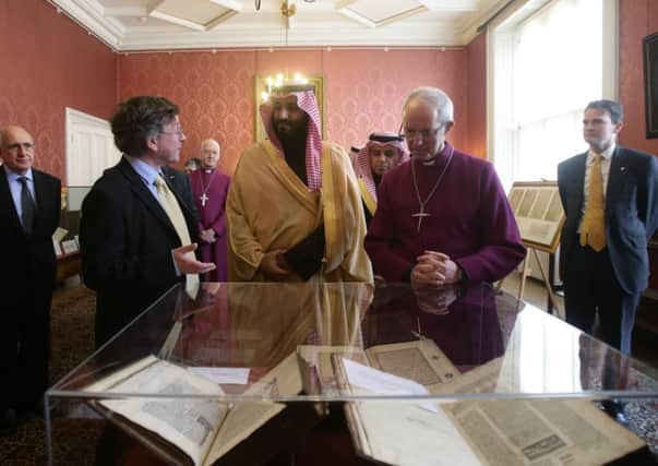 Saudi crown prince Mohammed bin Salman and Archbishop Justin Welby examine early religious documents in Lambeth Palace. Picture: Yui Mok - WPA Pool/Getty Images