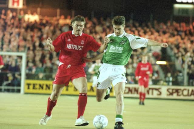 Aberdeen's Roy Aitken battles for possession with Hibs midfielder Brian Hamilton in 1993. Picture: Stephen Mansfield