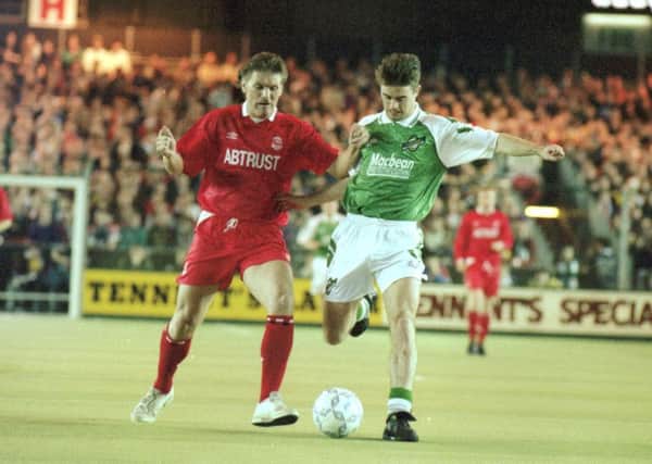 Aberdeen's Roy Aitken battles for possession with Hibs midfielder Brian Hamilton in 1993. Picture: Stephen Mansfield