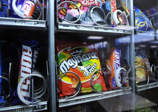Vending machines full of sweets and crisps are common sights in leisure centres (Picture: PA)