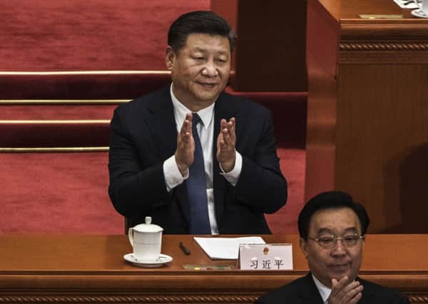 China's President Xi Jinping applauds after a vote on an amendment to the constitution during a session of the National People's Congress. Picture: Kevin Frayer/Getty