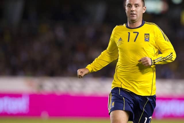 Kris Boyd wearing a similar yellow and navy change kit against Sweden in August 2010. Picture: SNS Group