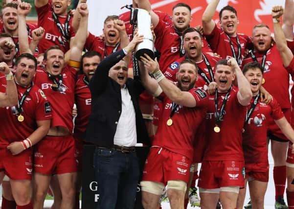 Scarlets' John Barclay lifts the trophy with team-mates after the Guinness Pro12 final at the Aviva Stadium, Dublin. Picture: Brian Lawless/PA