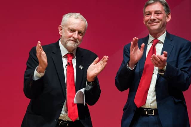 Labour leader Jeremy Corbyn reacts with Richard Leonard after giving his keynote speech to the Scottish Labour Party Conference at Caird Hall in Dundee: Picture: Jeff J Mitchell/Getty Images