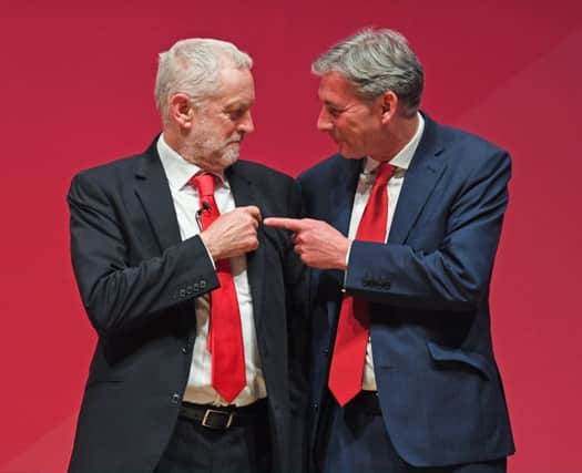 Labour leader Jeremy Corbyn reacts with Richard Leonard after giving his keynote speech to the Scottish Labour Party Conference at Caird Hall in Dundee: Picture: Jeff J Mitchell/Getty Images