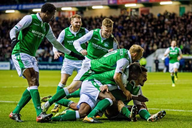 Hibs players celebrate after Jamie Maclaren doubles the scoring. Picture: SNS