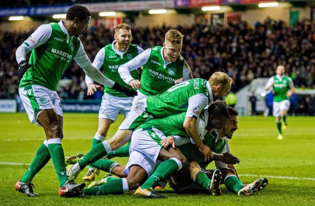 Hibs players celebrate after Jamie Maclaren doubles the scoring. Picture: SNS