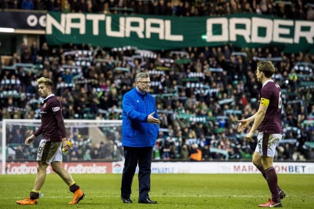 Hibs fans goad Craig Levein with a banner hung from the Famous Five Stand.  Photograph: Alan Harvey/SNS