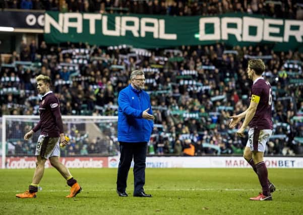 Hibs fans goad Craig Levein with a banner hung from the Famous Five Stand.  Photograph: Alan Harvey/SNS