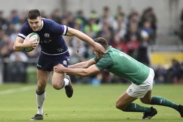 Blair Kinghorn is caught by Ireland's Jacob Stockdale. Picture: Ian Rutherford