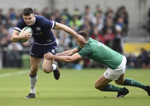 Blair Kinghorn is caught by Ireland's Jacob Stockdale. Picture: Ian Rutherford