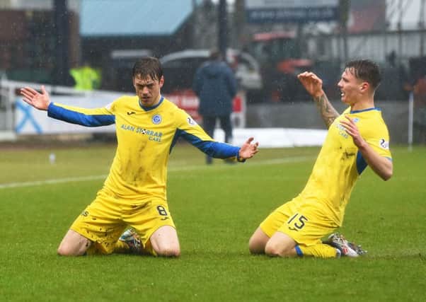 Murray Davidson, left, celebrates the opener with Jason Kerr. Picture: SNS